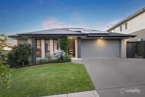 Property photo of 4 Devocean Place Cameron Park NSW 2285