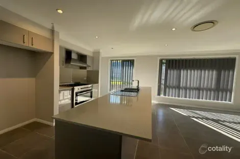 Property photo of 21 Hooghly Avenue Cameron Park NSW 2285