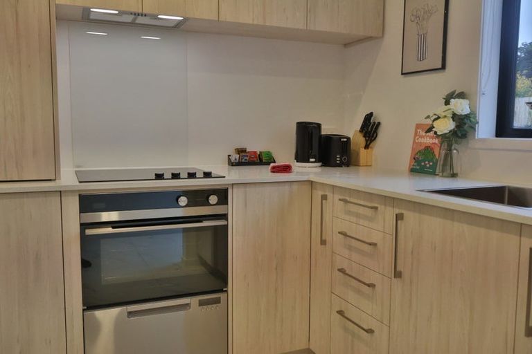 Photo of property in 2/23 Awaroa Road, Sunnyvale, Auckland, 0612