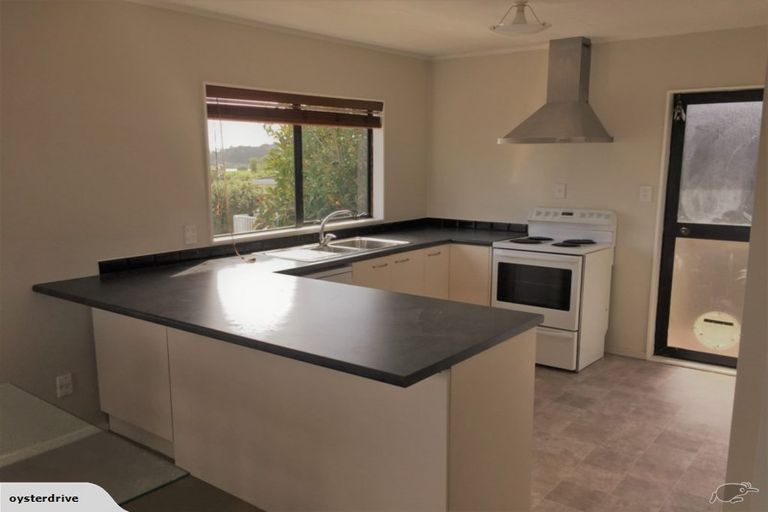 Photo of property in 1/6 Grenadine Place, Unsworth Heights, Auckland, 0632